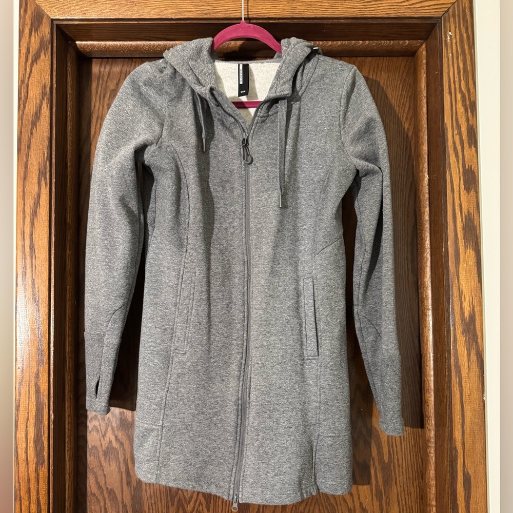 This is a warm, thick knit dress.  Looks great with leggings and boots.